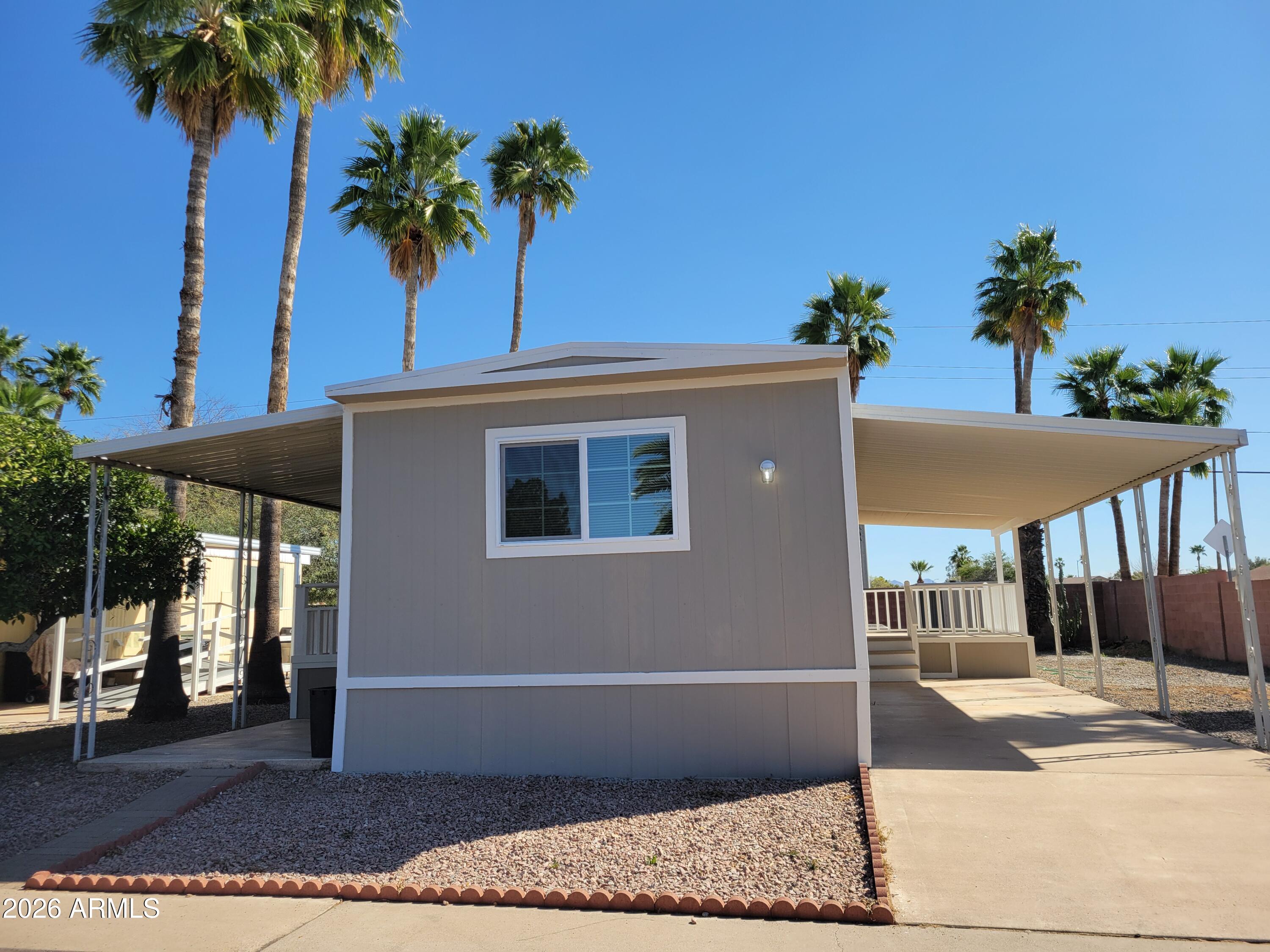 18026 North Cave Creek Road, Unit 1 Phoenix, AZ 85032 - Photo 1 of 14 a view of a house with a potted plant
