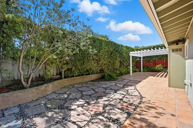 a large kitchen with stainless steel appliances granite countertop a stove and a refrigerator