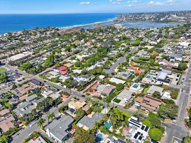 an aerial view of a house with a yard and garden