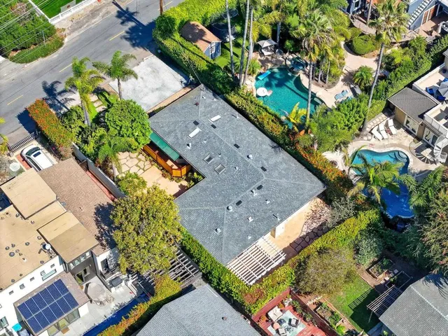 a view of a cars is parked in front of a house