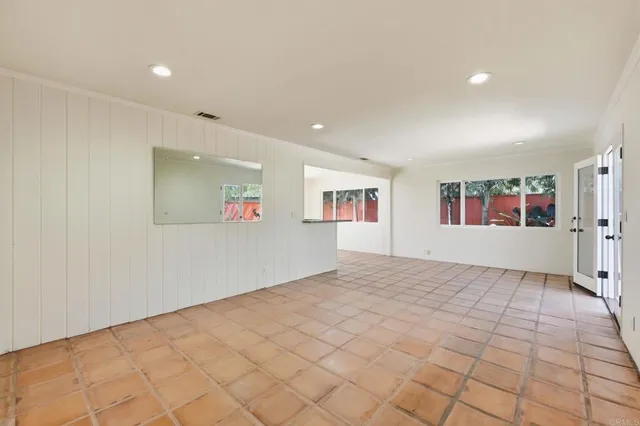 a view of an empty room and window