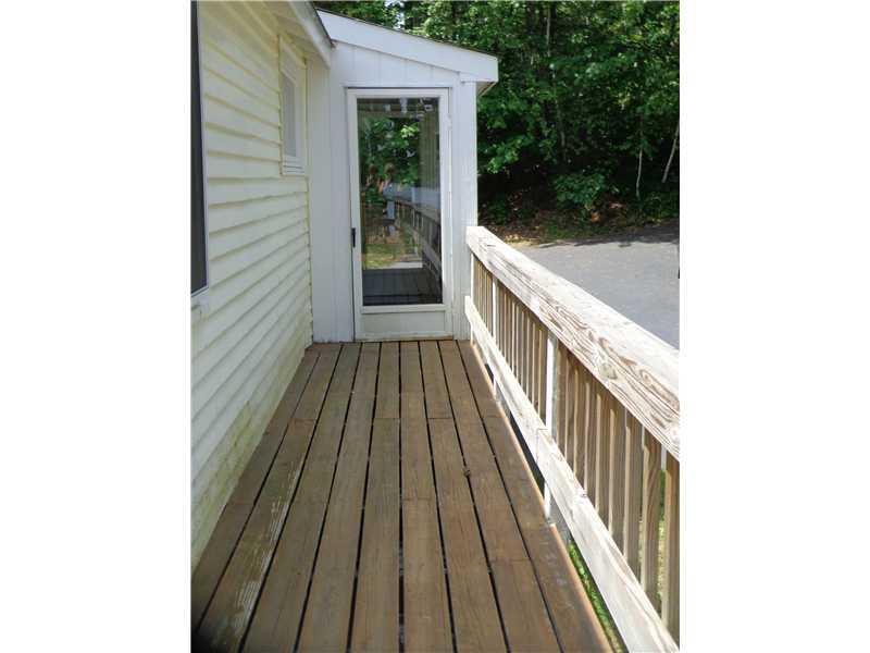74 Deer Acres Road Raymond, ME 04071 - Photo 16 of 35 Patio/Deck. Deck wraps around on...