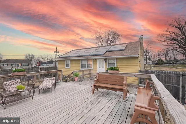 a view of house with deck outdoor seating and city view