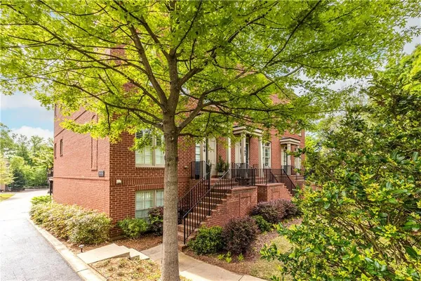 front view of a house with a tree