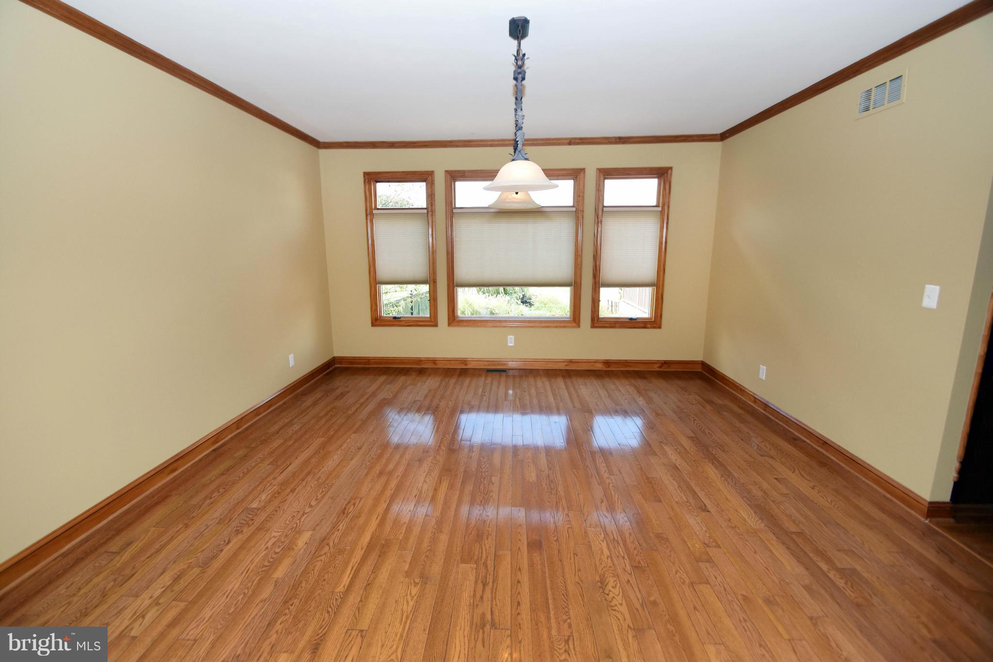 712 Connolly Farms Road Fallston, MD 21047 - Photo 11 of 30 a view of empty room with wooden floor and fan