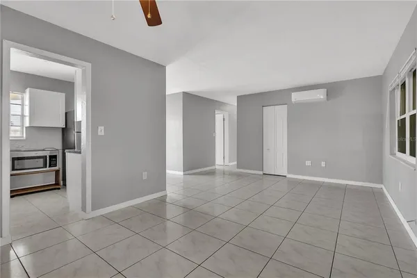 a view of an empty room with a fireplace