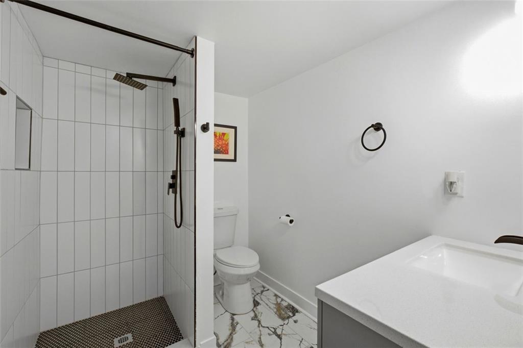 965 Houston Mill Road Northeast Atlanta, GA 30329 - Photo 29 of 42 a bathroom with a sink toilet and shower