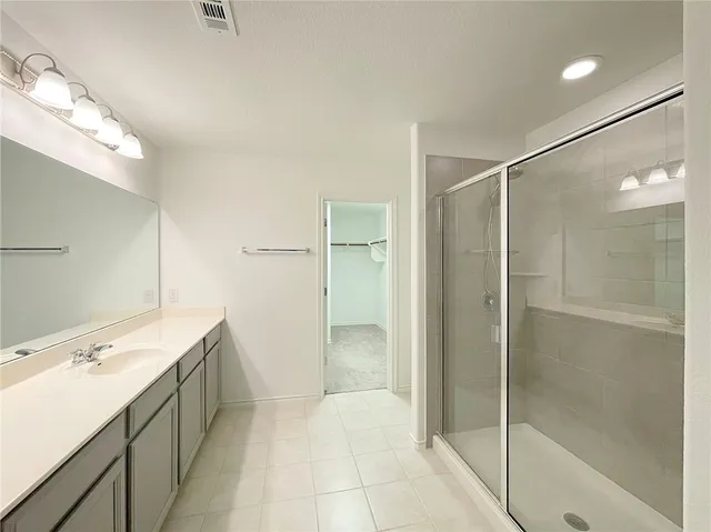 a bathroom with a shower and a toilet
