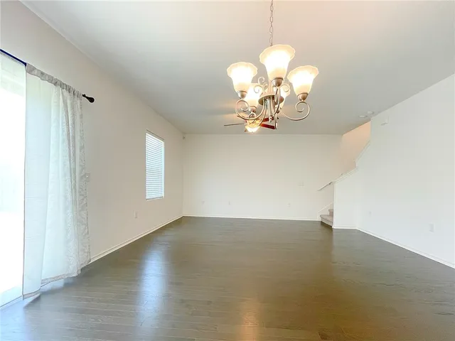 a kitchen with a sink a counter top space appliances and cabinets