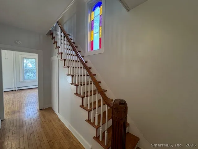 a view of entryway with wooden floor