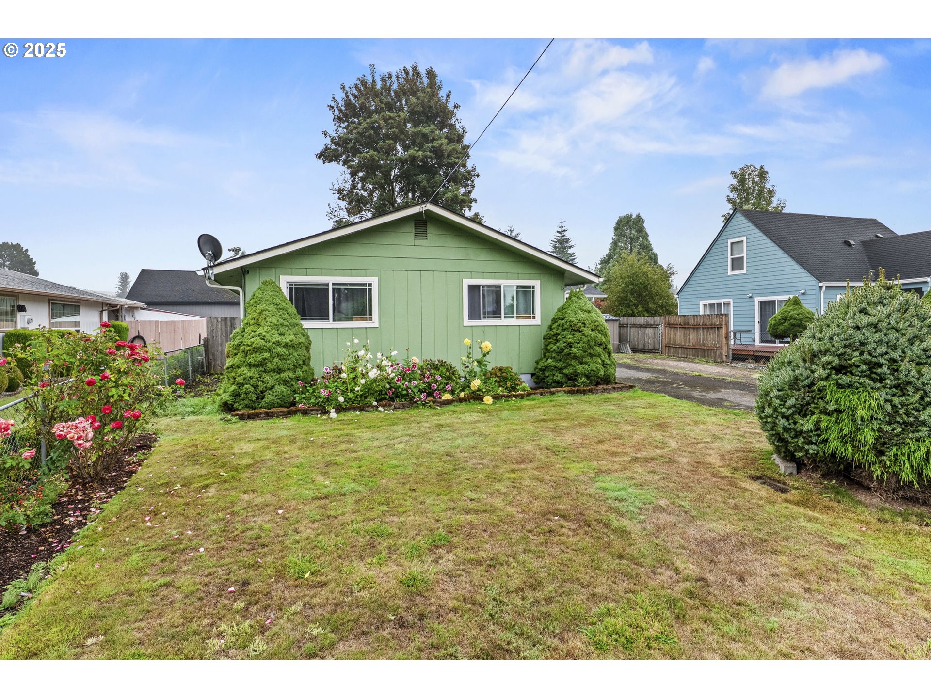 2634 34th Avenue Longview, WA 98632 - Photo 22 of 22 a view of a house with a yard and potted plants