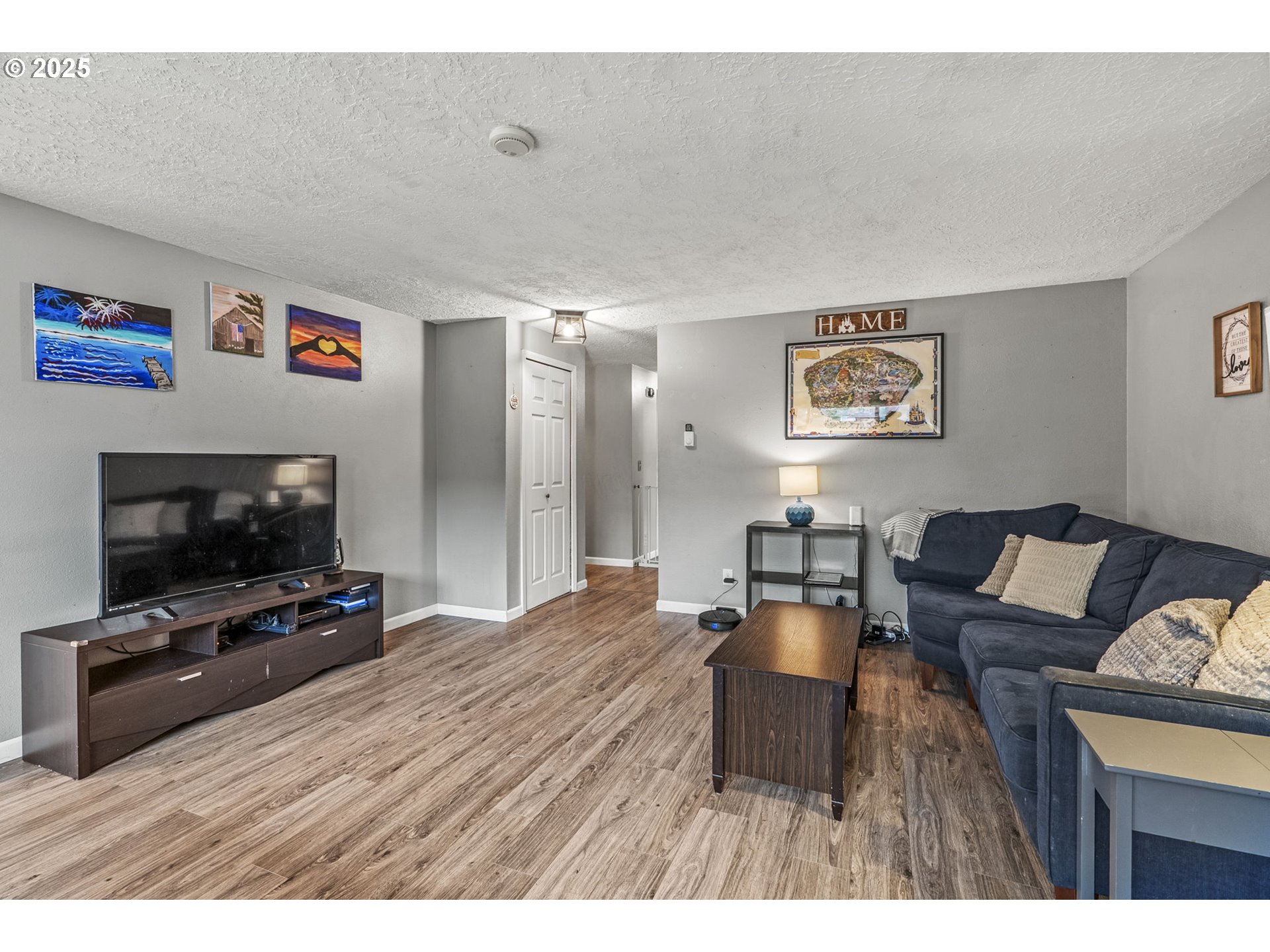2634 34th Avenue Longview, WA 98632 - Photo 5 of 22 a living room with furniture and a flat screen tv