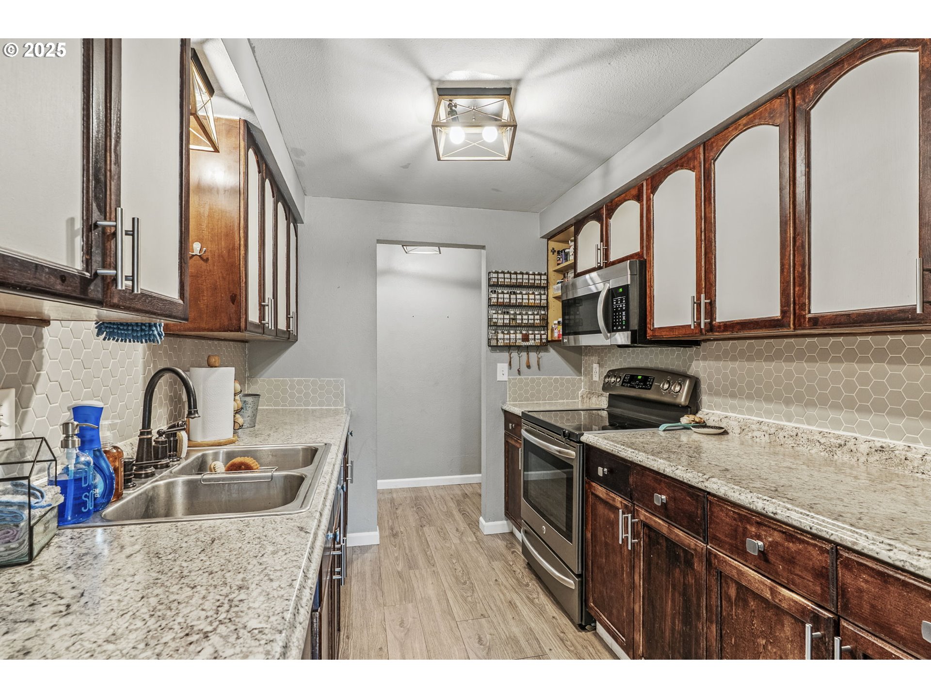 2634 34th Avenue Longview, WA 98632 - Photo 9 of 22 a kitchen with stainless steel appliances granite countertop a sink stove and cabinets