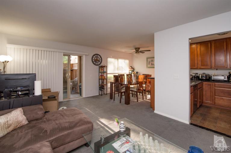 1718 Sinaloa Road, Unit 117 Simi Valley, CA 93065 - Photo 11 of 23 a living room with furniture and wooden floor