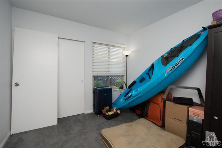 1718 Sinaloa Road, Unit 117 Simi Valley, CA 93065 - Photo 19 of 23 a room with stairs and white walls