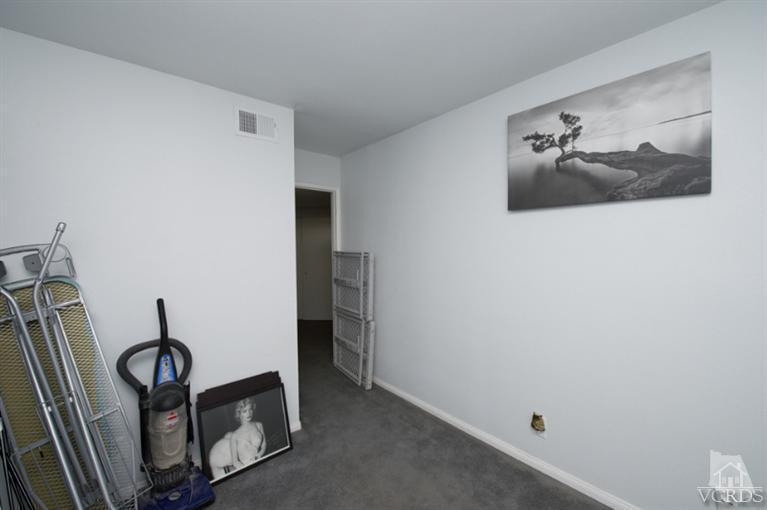 1718 Sinaloa Road, Unit 117 Simi Valley, CA 93065 - Photo 20 of 23 a view of a hallway with workspace