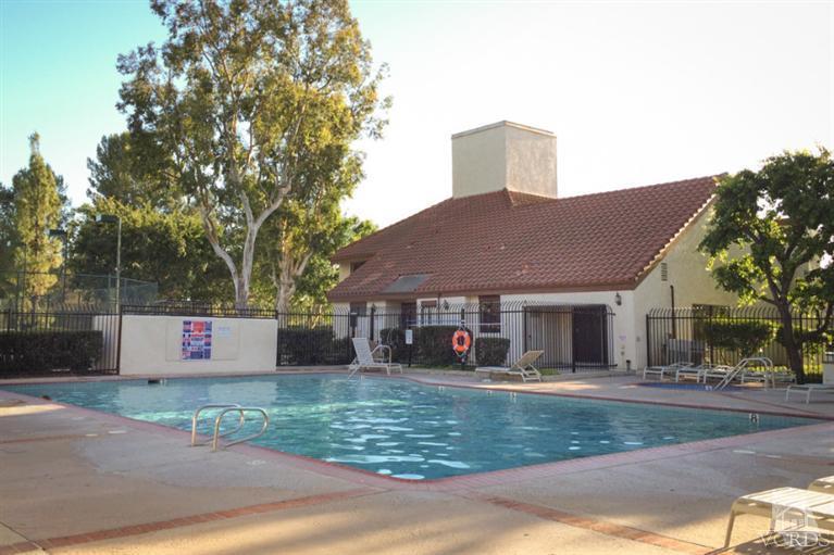 1718 Sinaloa Road, Unit 117 Simi Valley, CA 93065 - Photo 22 of 23 a front view of a house with a yard