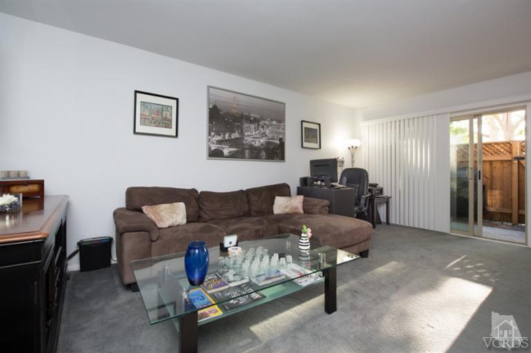 1718 Sinaloa Road, Unit 117 Simi Valley, CA 93065 - Photo 4 of 23 a living room with furniture and a window