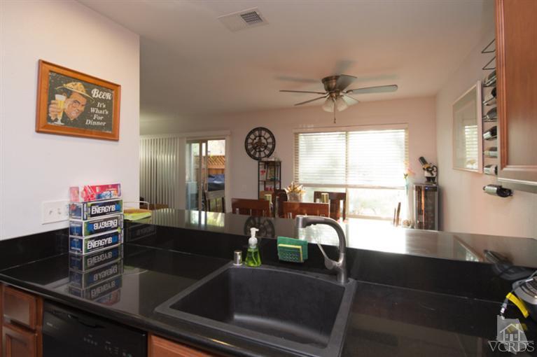 1718 Sinaloa Road, Unit 117 Simi Valley, CA 93065 - Photo 10 of 23 a view of a dining room with furniture and chandelier