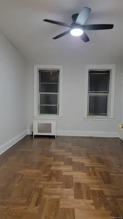 a view of empty room with a fireplace