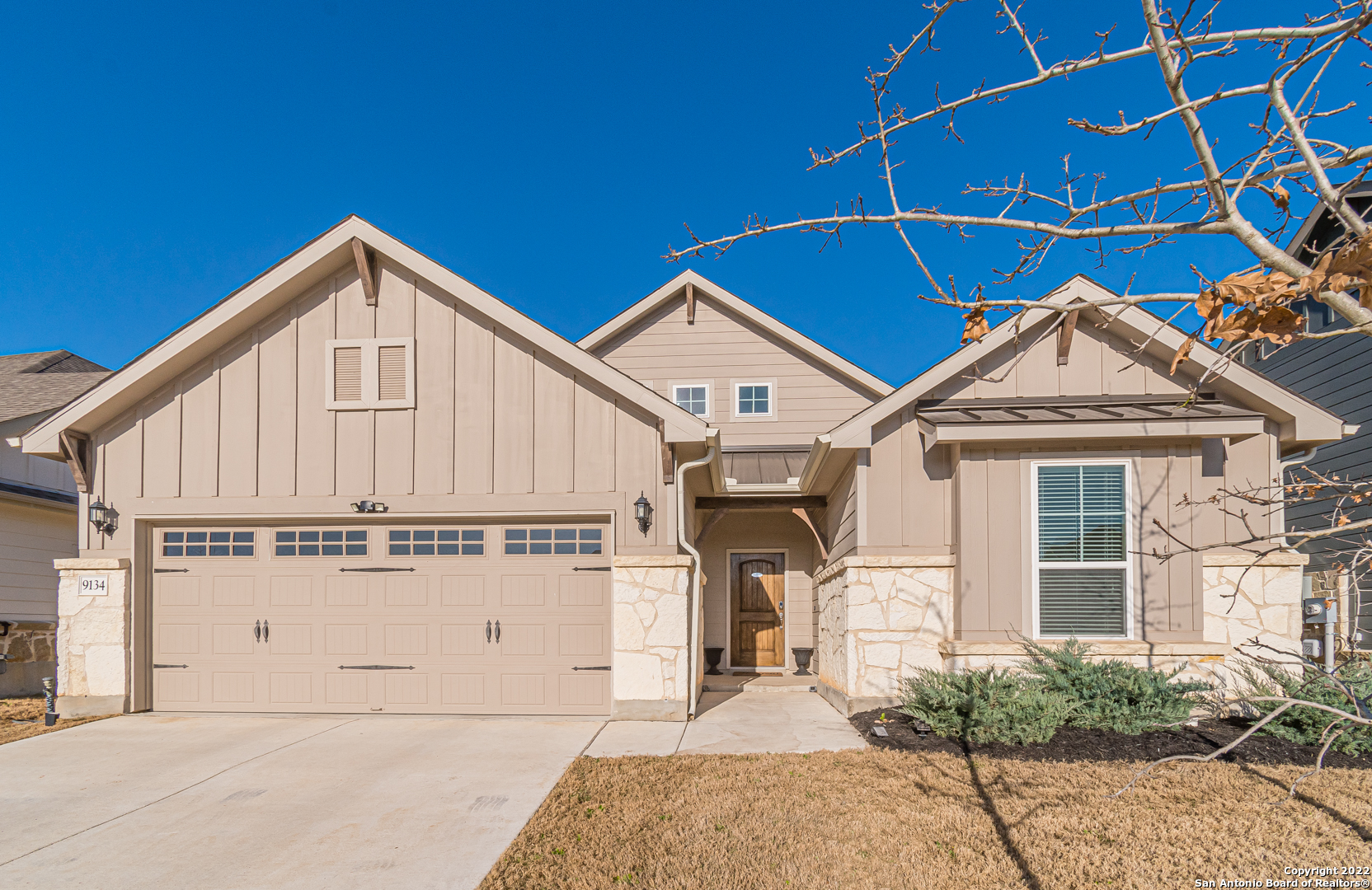 9134 Curling Post Schertz, TX 78154 - Photo 1 of 1 a view of a white house with large windows and a small yard