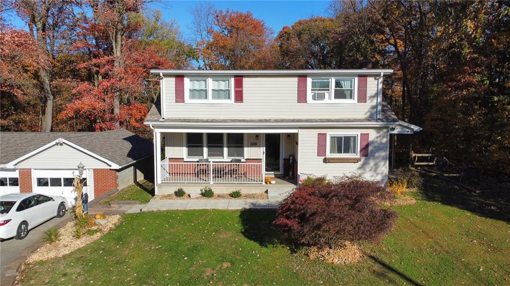 130 Waltz Mill Road Ruffs Dale, PA 15679 - Photo 1 of 34 a front view of a house with a yard