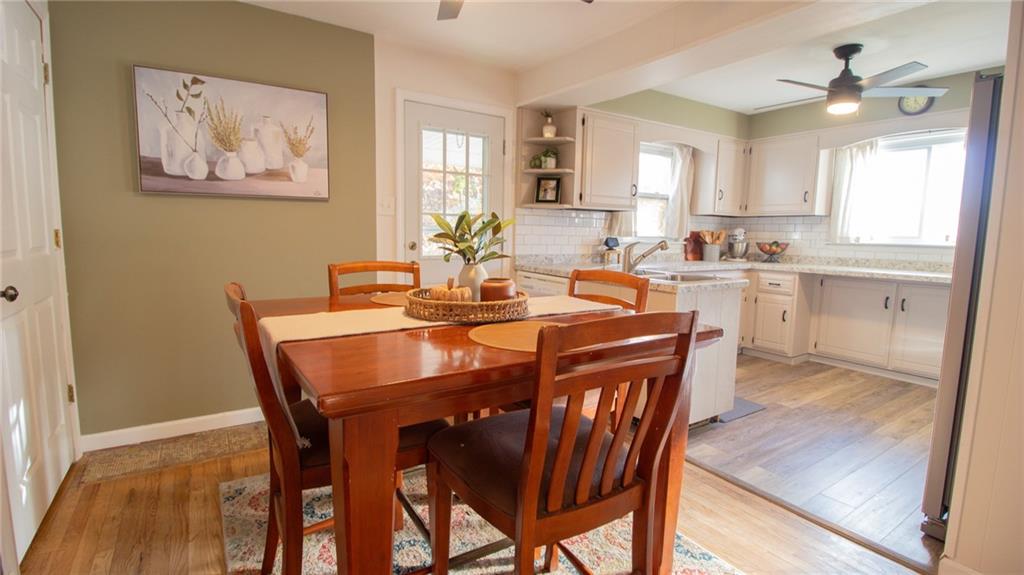 130 Waltz Mill Road Ruffs Dale, PA 15679 - Photo 11 of 34 a view of a dining room and livingroom with furniture window and wooden floor