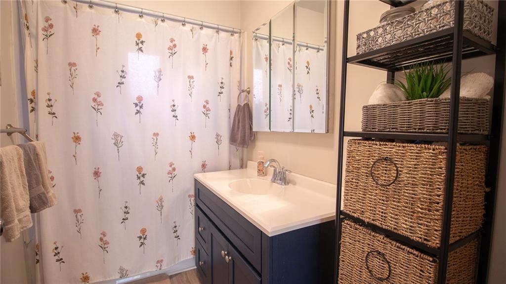 130 Waltz Mill Road Ruffs Dale, PA 15679 - Photo 16 of 34 a bathroom with a sink and mirror