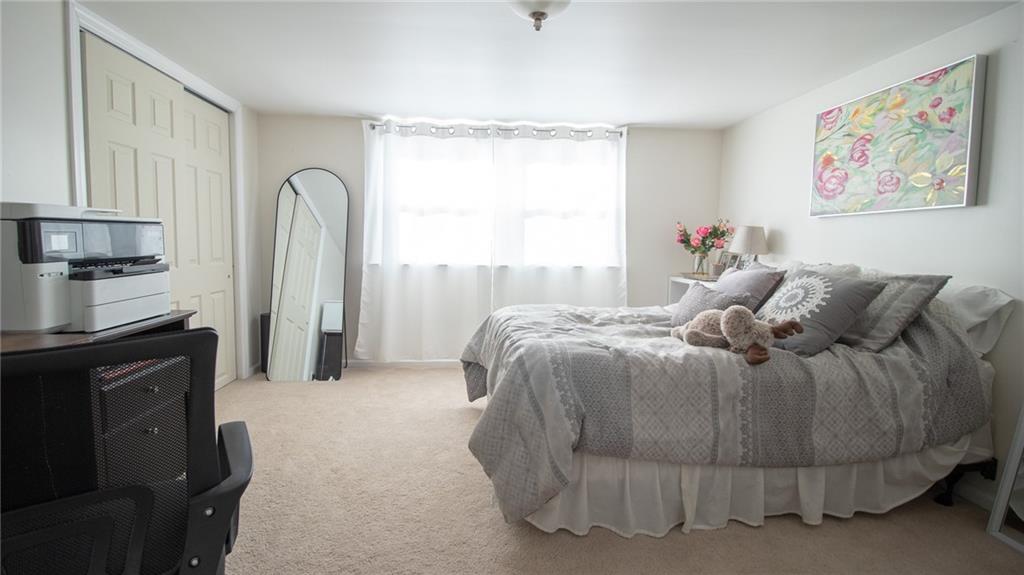 130 Waltz Mill Road Ruffs Dale, PA 15679 - Photo 20 of 34 a spacious bedroom with a bed and a cabinets
