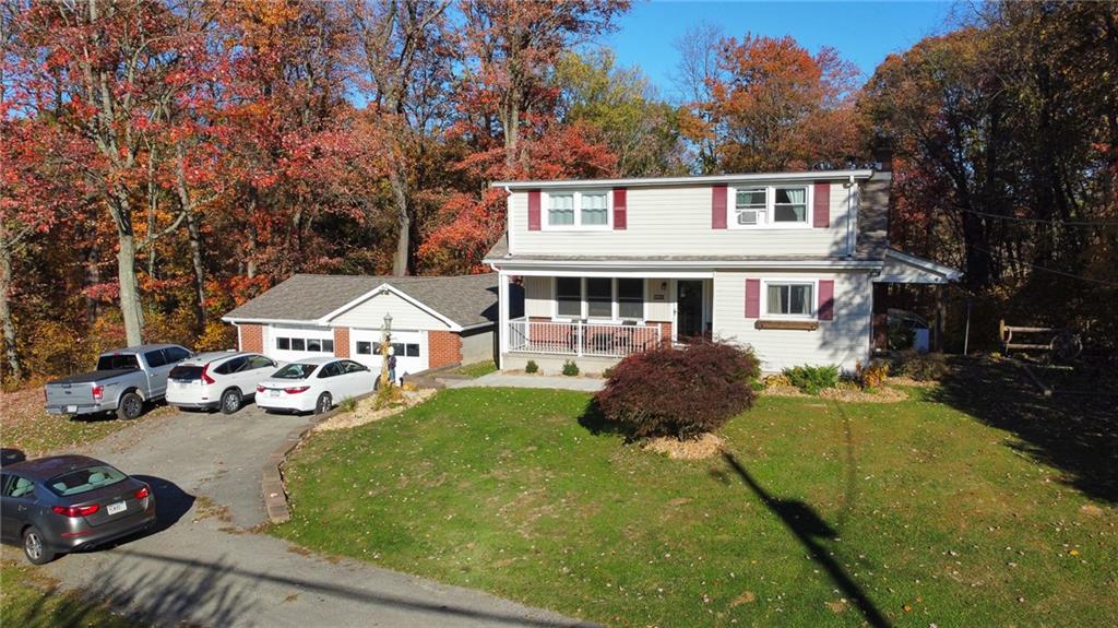 130 Waltz Mill Road Ruffs Dale, PA 15679 - Photo 2 of 34 front view of a house with a yard