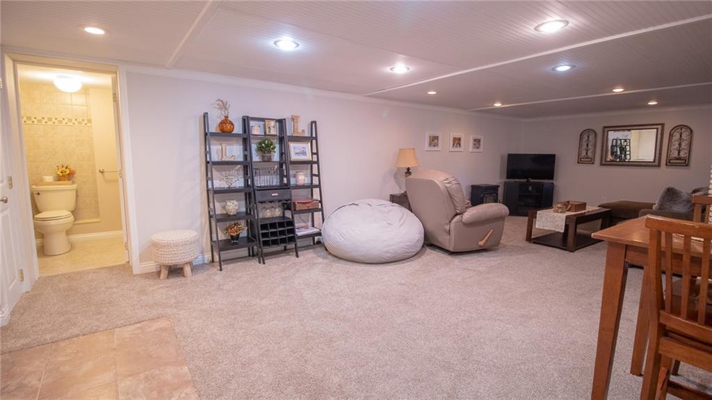 130 Waltz Mill Road Ruffs Dale, PA 15679 - Photo 21 of 34 a living room with furniture gym equipment and a view of living room