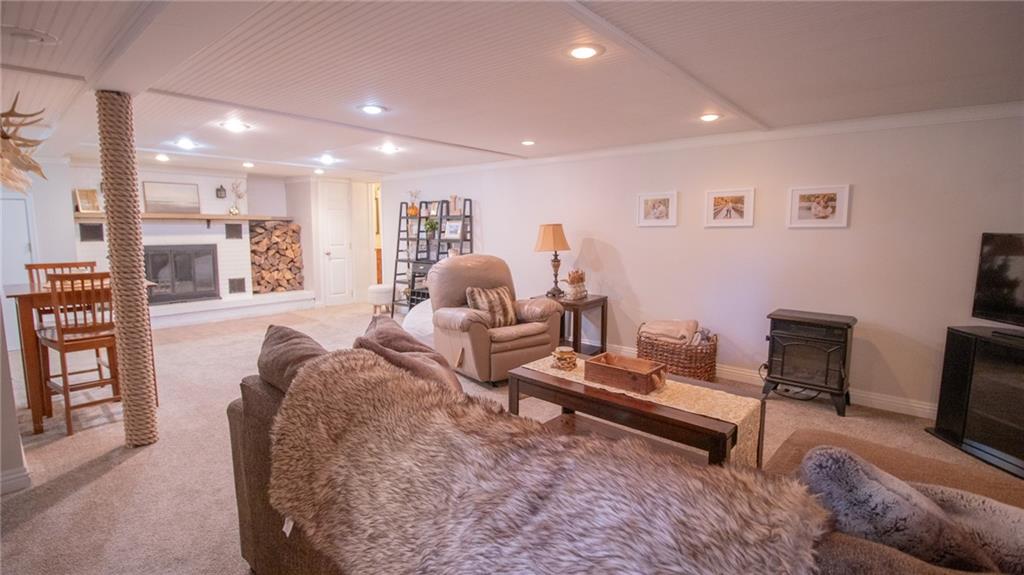 130 Waltz Mill Road Ruffs Dale, PA 15679 - Photo 23 of 34 a living room with furniture and a wooden floor