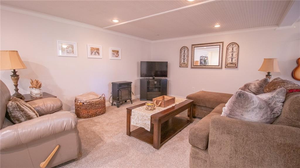 130 Waltz Mill Road Ruffs Dale, PA 15679 - Photo 24 of 34 a living room with furniture and a flat screen tv