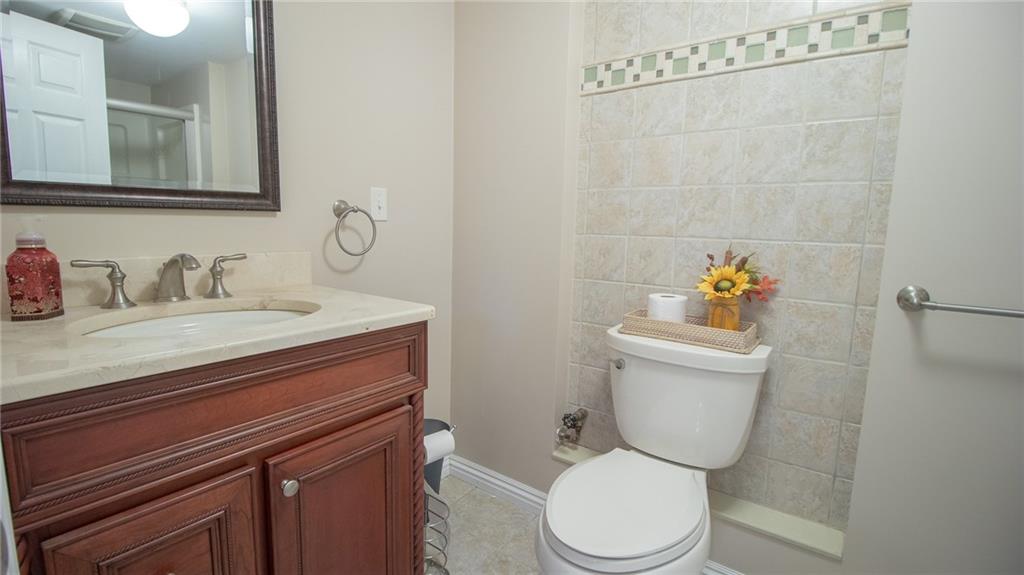 130 Waltz Mill Road Ruffs Dale, PA 15679 - Photo 25 of 34 a bathroom with a toilet sink and mirror