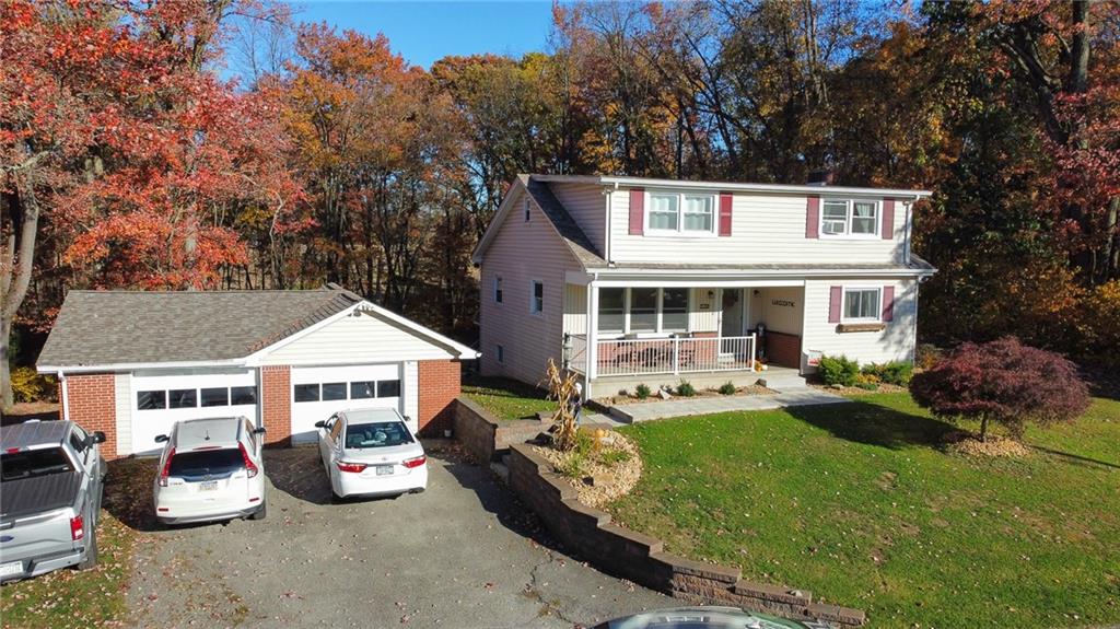 130 Waltz Mill Road Ruffs Dale, PA 15679 - Photo 3 of 34 a view of a house with backyard sitting area and garden