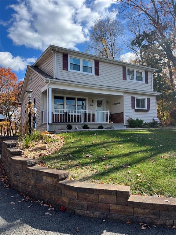 130 Waltz Mill Road Ruffs Dale, PA 15679 - Photo 4 of 34 a front view of a house with a yard