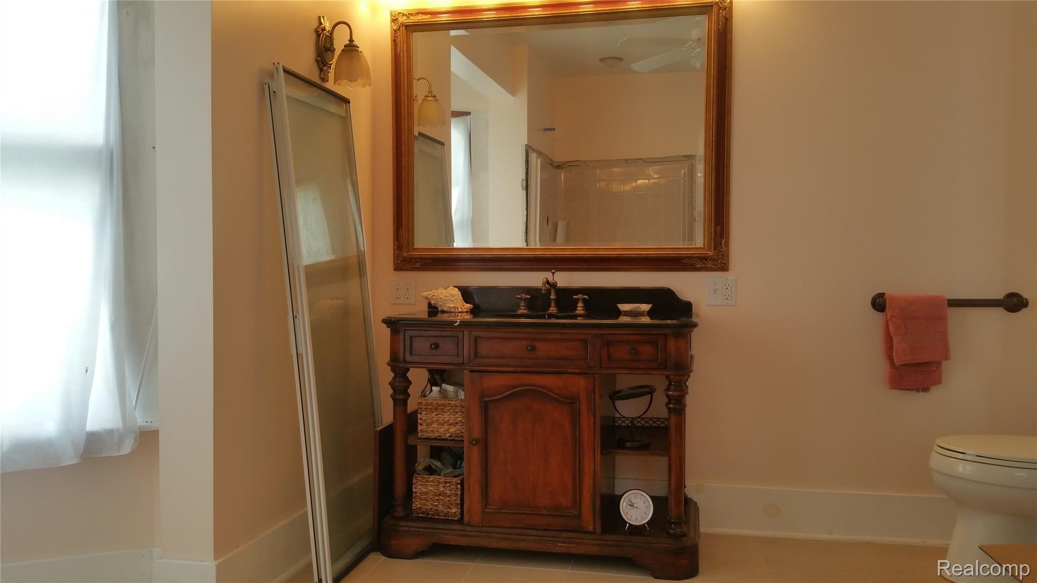 5259 Sheffer Road Prescott, MI 48756 - Photo 23 of 60 New floor, Vanity, Light fixture and Mirror Toilet seat. and towel rack