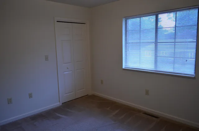 an empty room with windows