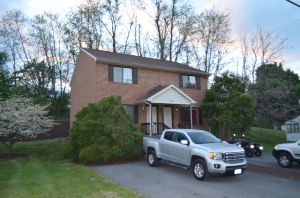 a car parked in front of a house