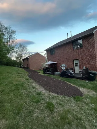 a house view with a backyard space