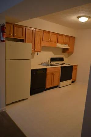 a kitchen with stainless steel appliances a refrigerator and a stove