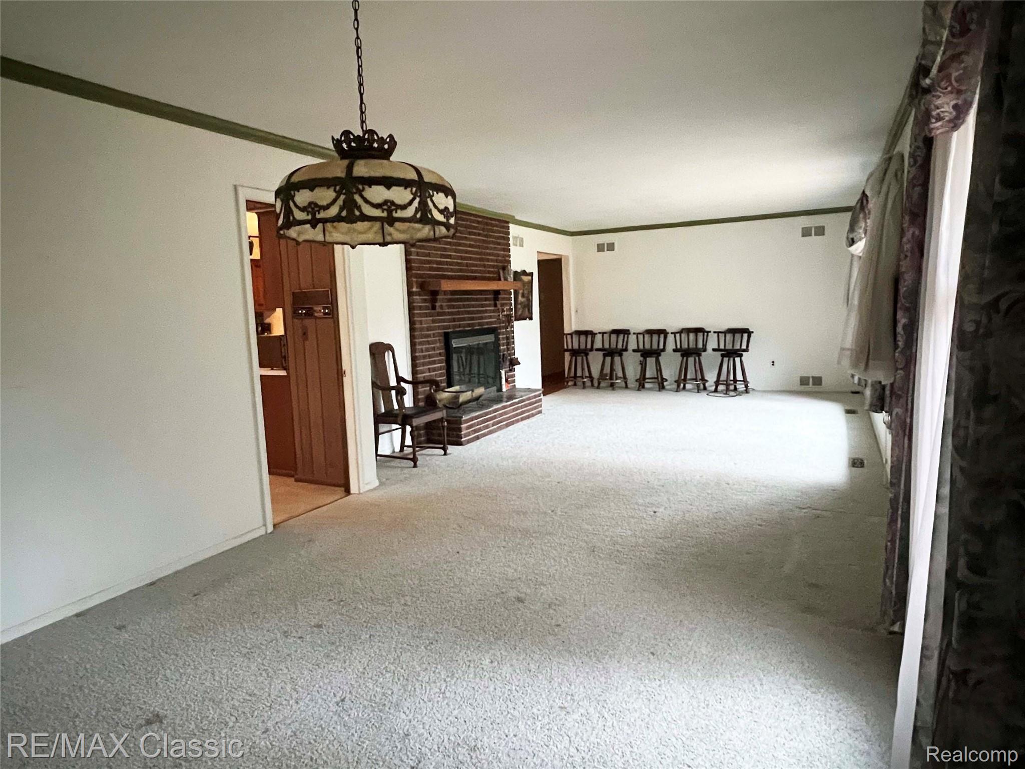 1753 Old Plank Road Milford, MI 48381 - Photo 9 of 32 Living room leads to the kitchen & bedrooms