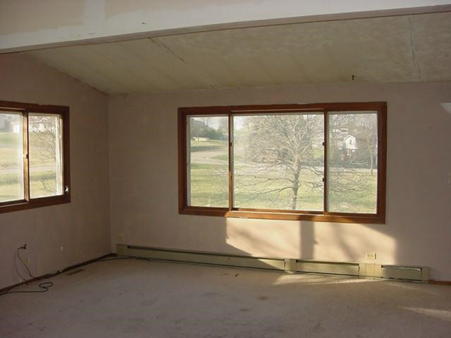 429 Marstonmoor Road Davis, IL 61019 - Photo 2 of 9 an empty room with a fireplace