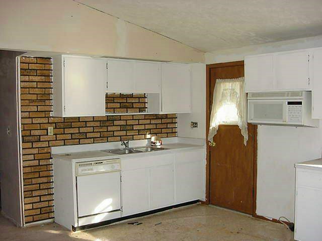 429 Marstonmoor Road Davis, IL 61019 - Photo 4 of 9 a kitchen with stainless steel appliances granite countertop a sink and a cabinets