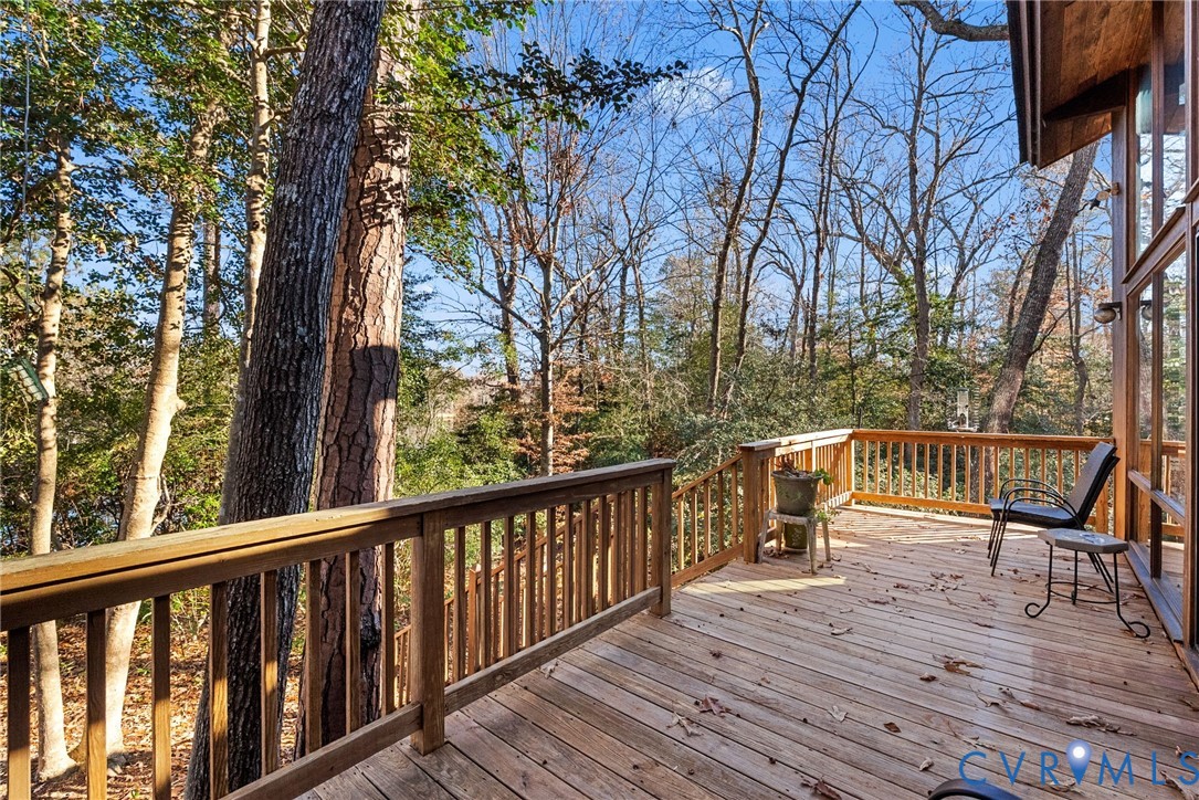 701 Colony Trail Lanexa, VA 23089 - Photo 15 of 50 a view of balcony with deck and wooden floor
