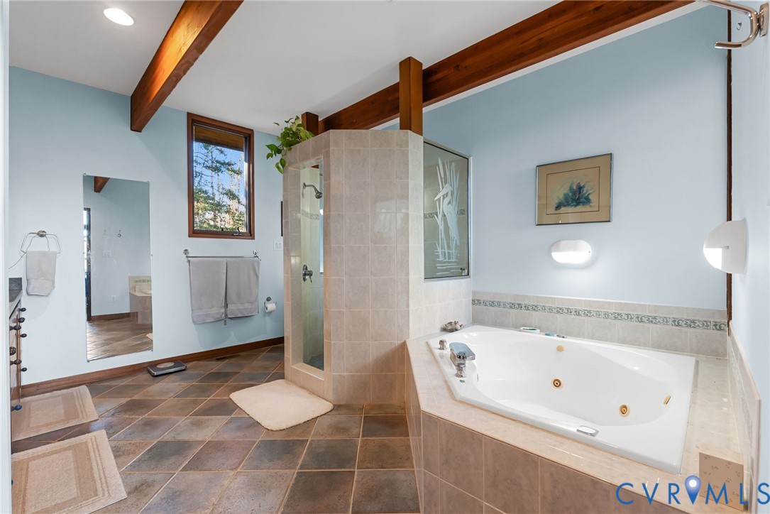 701 Colony Trail Lanexa, VA 23089 - Photo 39 of 50 a bathroom with a bathtub and a shower