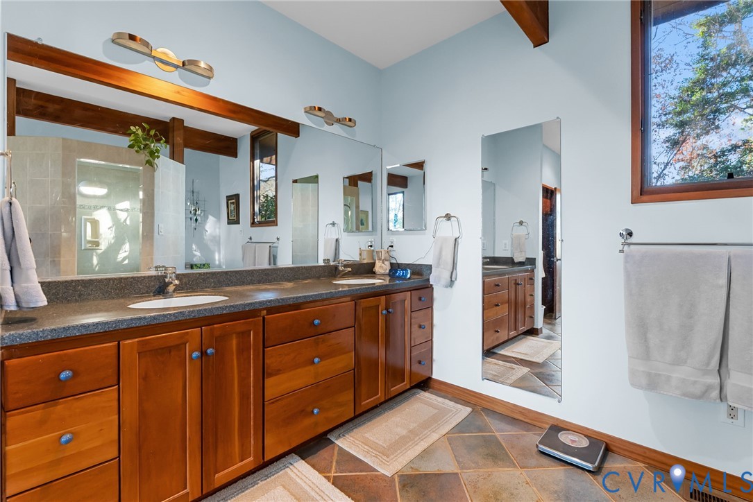 701 Colony Trail Lanexa, VA 23089 - Photo 40 of 50 a spacious bathroom with a granite countertop sink mirror and bathtub