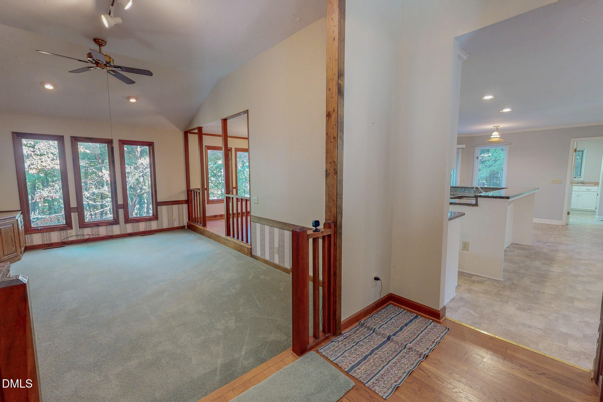 11 Denada Path Roxboro, NC 27574 - Photo 11 of 57 an empty room with windows and pillars in it