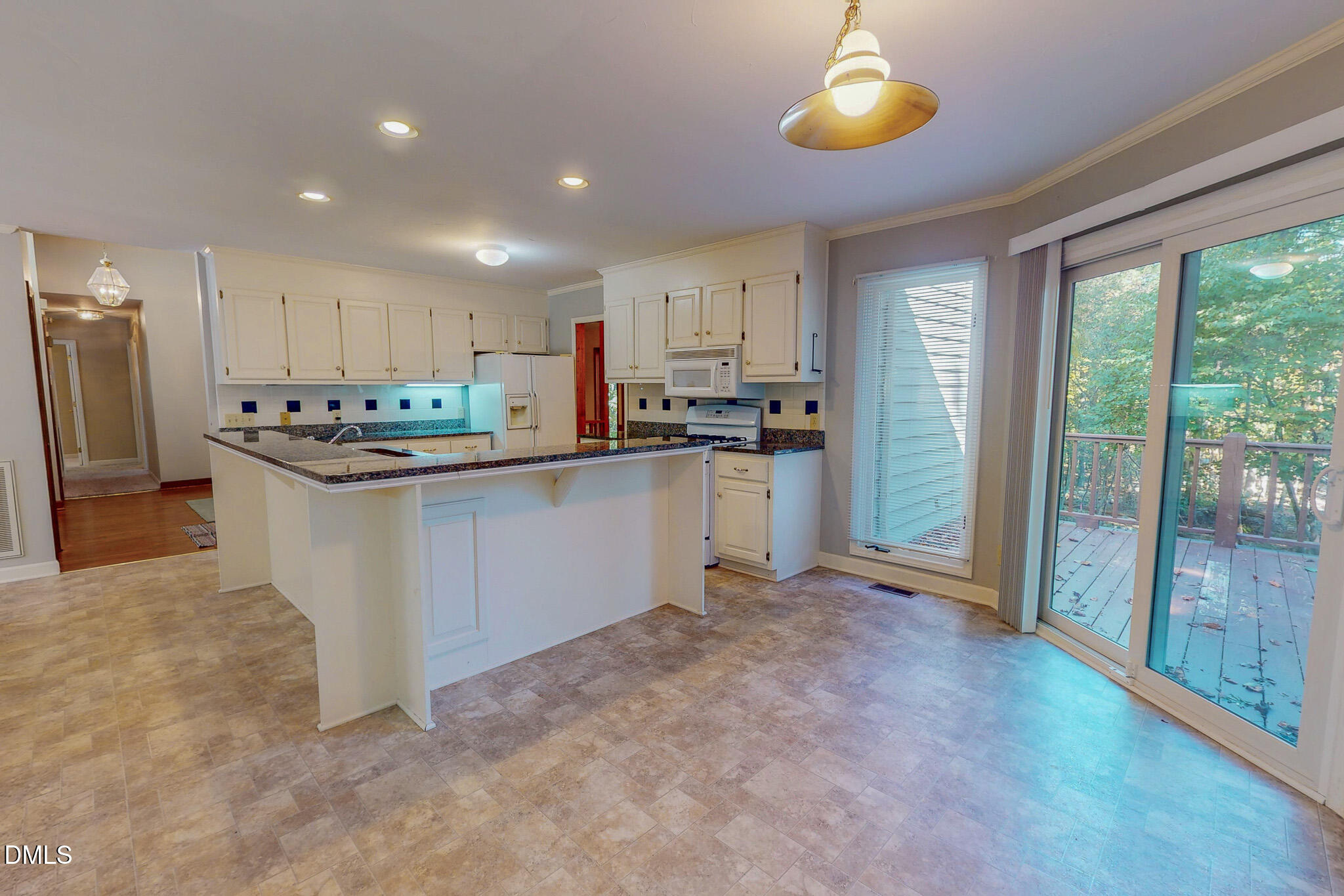 11 Denada Path Roxboro, NC 27574 - Photo 21 of 57 a kitchen with stainless steel appliances granite countertop a stove top oven a sink and a refrigerator