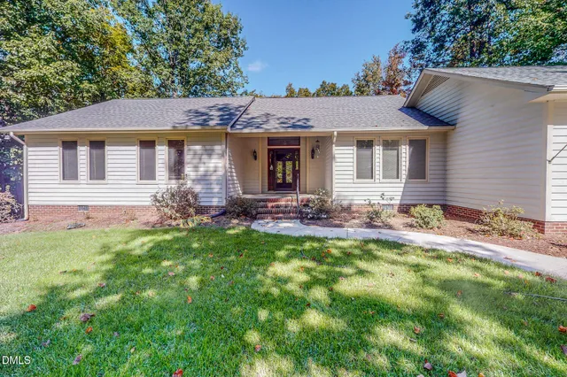 a front view of a house with yard